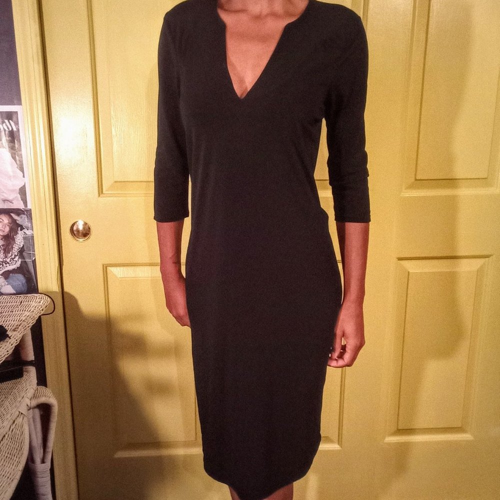 svelte black slip on dress with v neck opening.